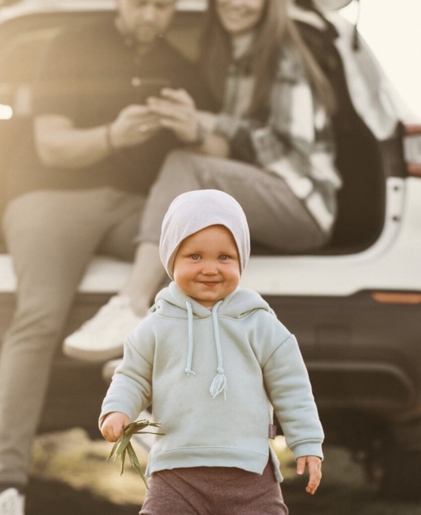 Happy Child with Family in the Car